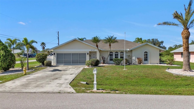 167 Mocha Ct, Punta Gorda, FL 33983 - ranch-style house featuring concrete driveway, a front lawn, stucco siding, and an attached garage