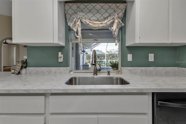 167 Mocha Ct, Punta Gorda, FL 33983 - kitchen with a sink, white cabinets, light countertops, and dishwasher
