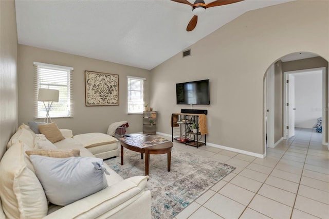 living room featuring ceiling fan, plenty of natural light, and vaulted ceiling