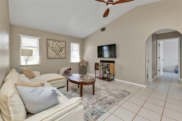 167 Mocha Ct, Punta Gorda, FL 33983 - living room with ceiling fan, arched walkways, plenty of natural light, light tile patterned floors, and vaulted ceiling