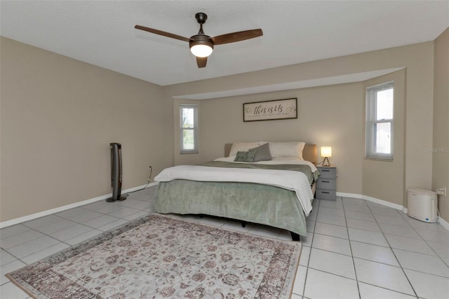 167 Mocha Ct, Punta Gorda, FL 33983 - bedroom featuring light tile patterned floors, baseboards, and a ceiling fan