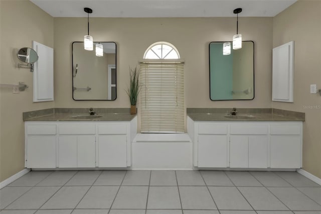 bathroom with tile patterned floors and vanity