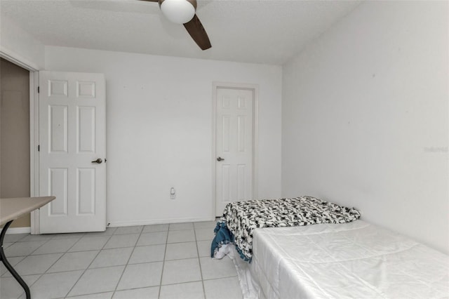 167 Mocha Ct, Punta Gorda, FL 33983 - bedroom with light tile patterned flooring and a ceiling fan