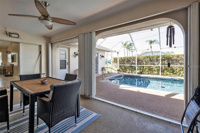 view of swimming pool featuring ceiling fan