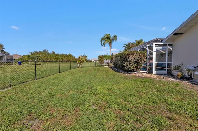 view of yard with a lanai