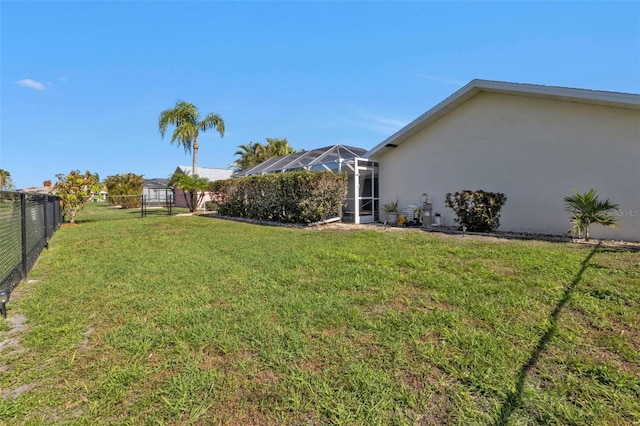 view of yard with a lanai