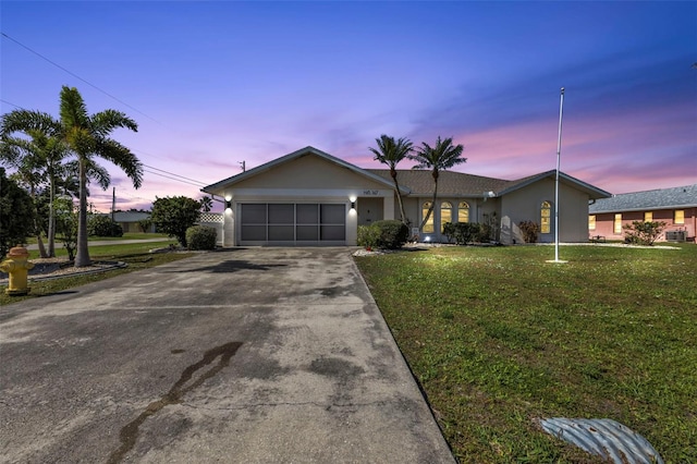167 Mocha Ct, Punta Gorda, FL 33983 - single story home with driveway, a front lawn, a garage, and stucco siding