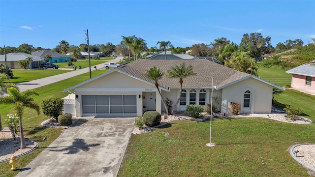 167 Mocha Ct, Punta Gorda, FL 33983 - single story home with stucco siding, an attached garage, driveway, and a front lawn