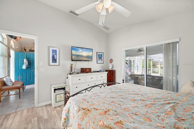 bedroom with ceiling fan, light hardwood / wood-style floors, lofted ceiling, and access to outside