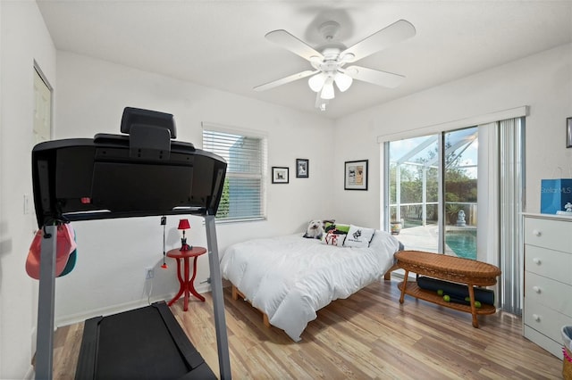 bedroom with ceiling fan and hardwood / wood-style flooring