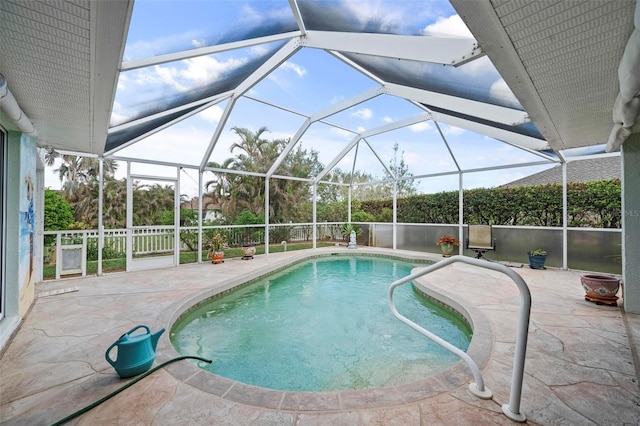 view of pool with a lanai and a patio area