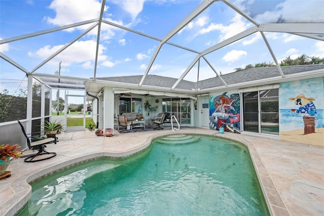 view of pool with a patio area, a lanai, and ceiling fan