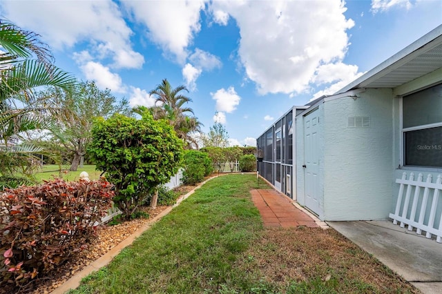 view of yard featuring a lanai