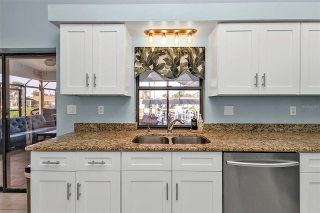 kitchen with sink, white cabinets, and stainless steel dishwasher