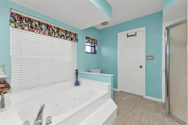 bathroom featuring tile patterned flooring and plus walk in shower