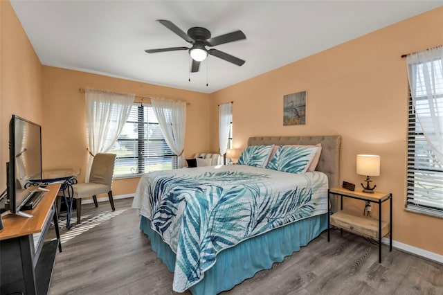 bedroom with hardwood / wood-style flooring and ceiling fan