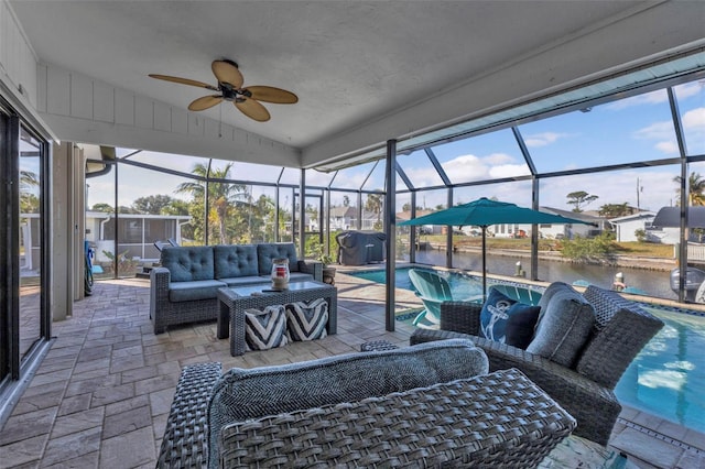 exterior space featuring area for grilling, an outdoor hangout area, a water view, and glass enclosure