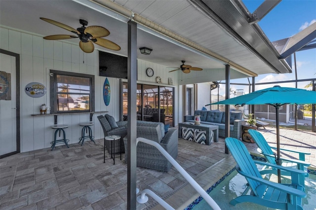 view of patio featuring a lanai, an outdoor living space, and exterior bar