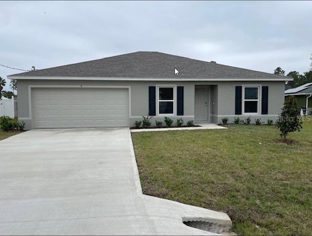 ranch-style home featuring a front yard and a garage