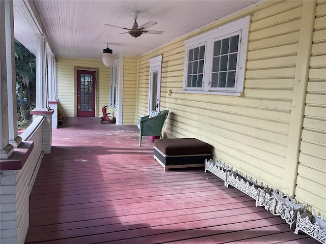 wooden terrace featuring ceiling fan and covered porch