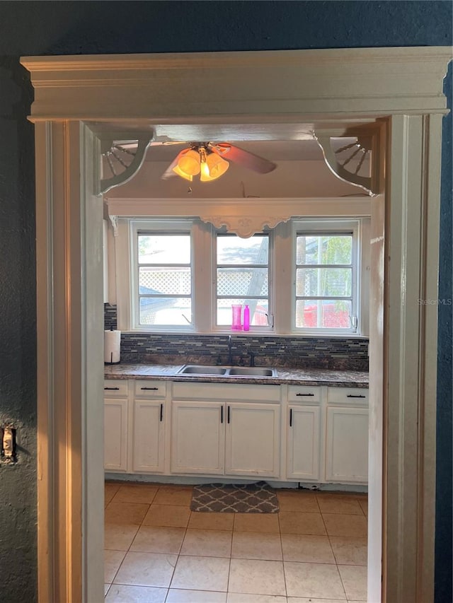 kitchen with white cabinetry, plenty of natural light, and sink