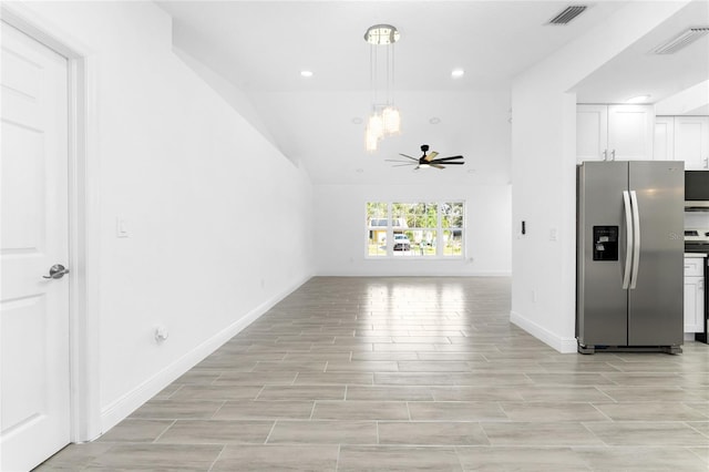 kitchen featuring white cabinets, stainless steel refrigerator with ice dispenser, and ceiling fan