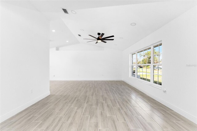 unfurnished living room featuring ceiling fan, light hardwood / wood-style floors, and lofted ceiling