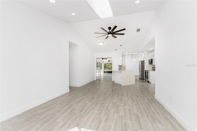 unfurnished living room featuring ceiling fan, high vaulted ceiling, and light hardwood / wood-style floors