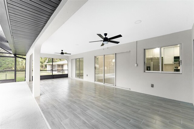 interior space featuring ceiling fan and a lanai