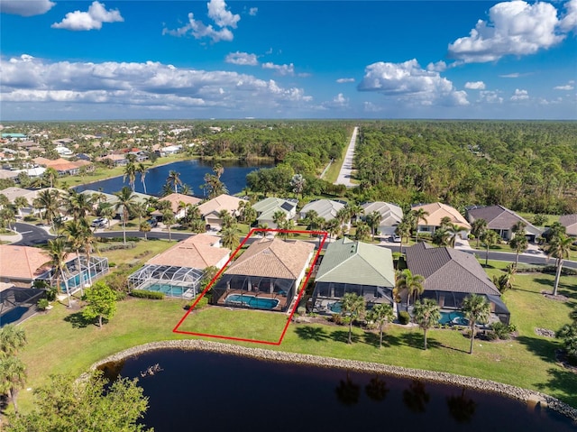 birds eye view of property with a water view