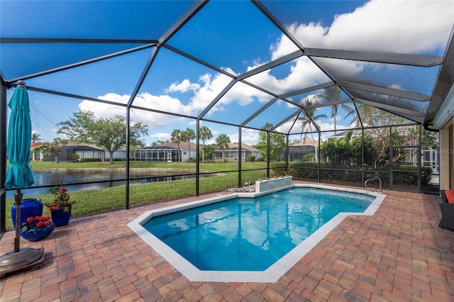 view of swimming pool featuring a lanai, a patio area, a water view, and a lawn