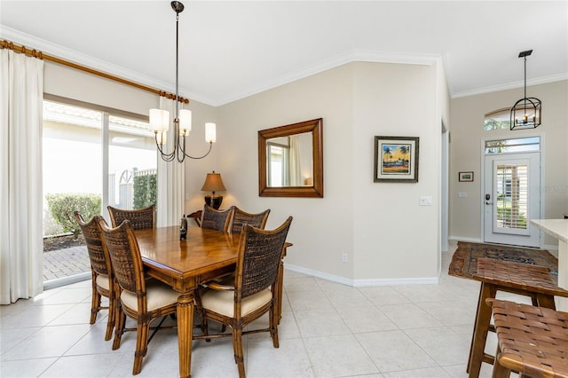 tiled dining area featuring crown molding and a chandelier