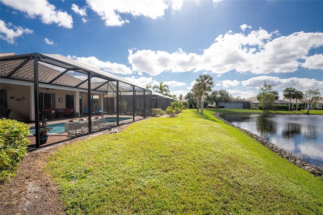 view of yard with a water view, glass enclosure, a fenced in pool, and a patio area