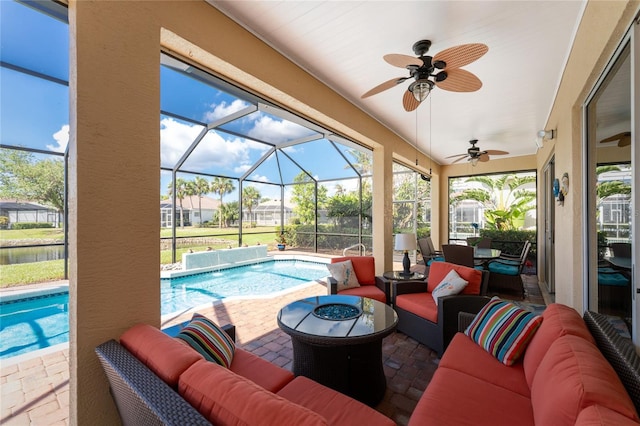 view of patio / terrace with outdoor lounge area, ceiling fan, and a lanai