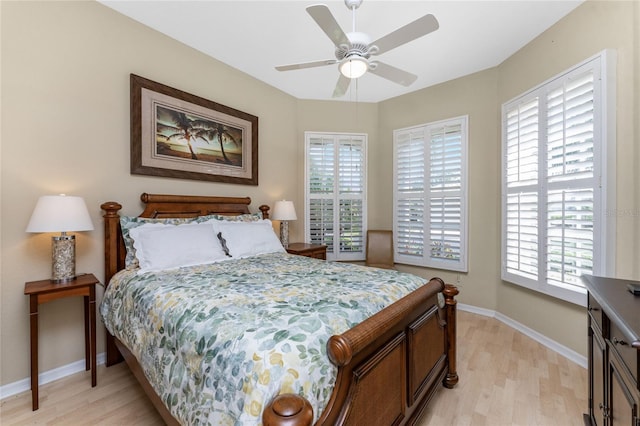 bedroom featuring ceiling fan and light hardwood / wood-style flooring