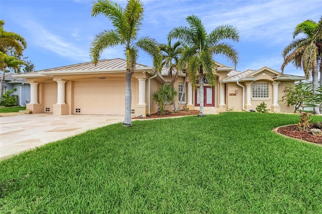 ranch-style home featuring a front lawn and a garage