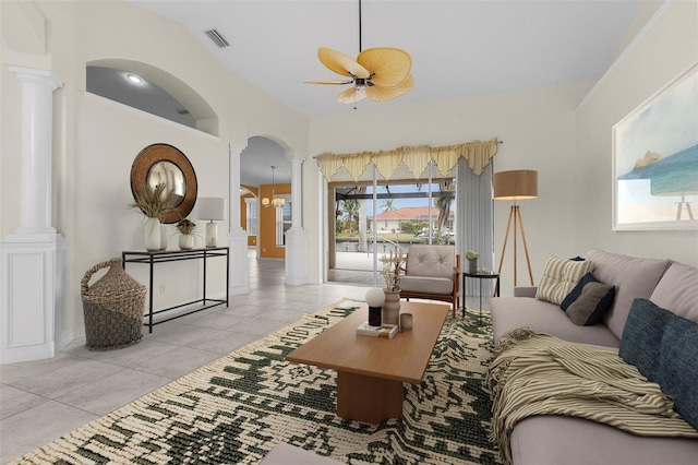 15460 Longview Rd, Port Charlotte, FL 33981 - living room with decorative columns, arched walkways, ceiling fan, tile patterned flooring, and lofted ceiling