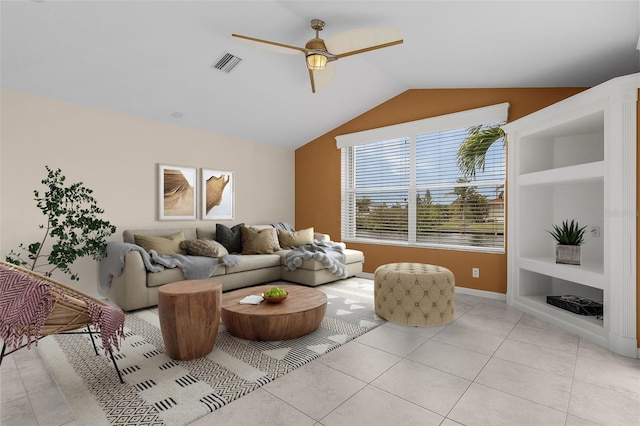 tiled living room with ceiling fan, built in features, and lofted ceiling