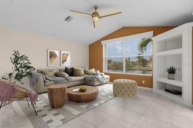 15460 Longview Rd, Port Charlotte, FL 33981 - living area featuring ceiling fan, vaulted ceiling, built in features, light tile patterned floors, and baseboards