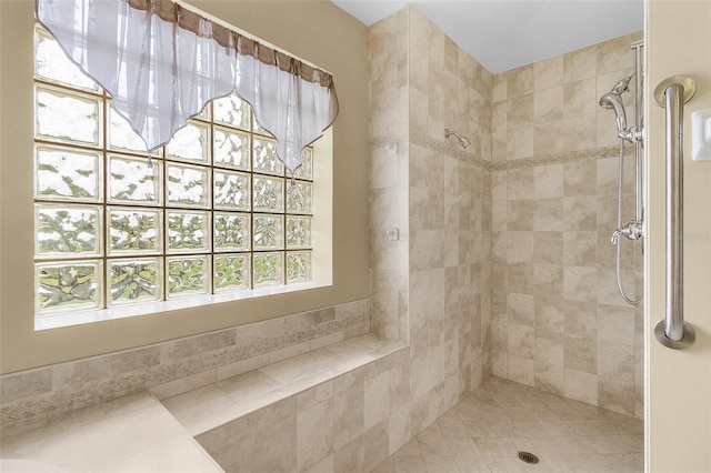 bathroom featuring tiled shower