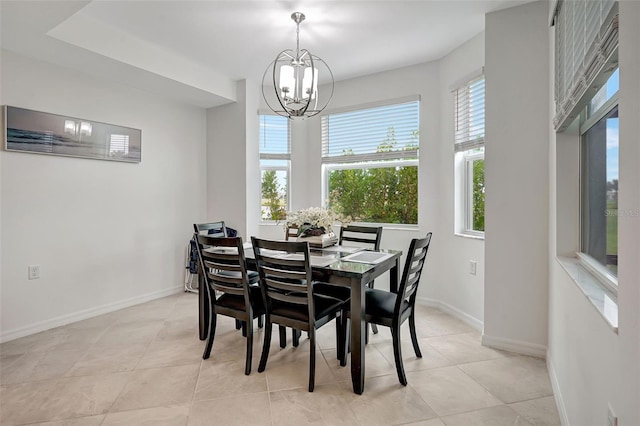 dining area with light tile patterned floors and a notable chandelier