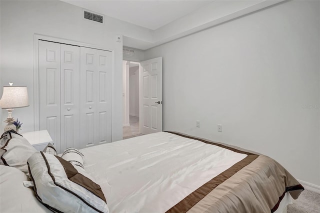 carpeted bedroom featuring a closet