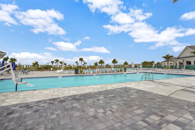 view of swimming pool featuring a patio