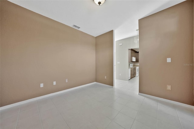 unfurnished room featuring light tile patterned flooring