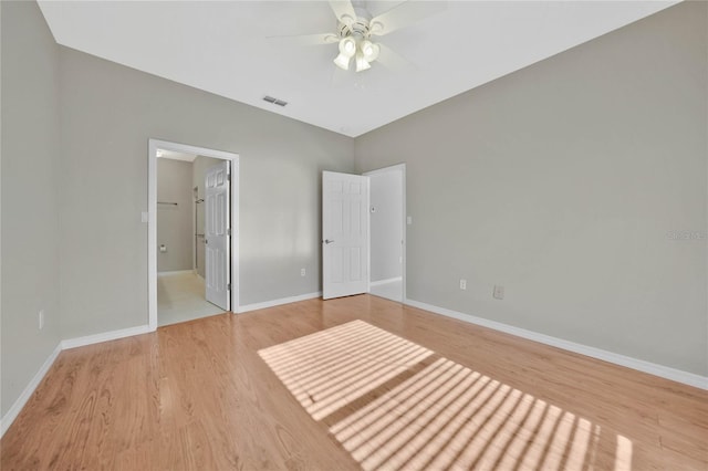 unfurnished bedroom with ceiling fan and light hardwood / wood-style flooring