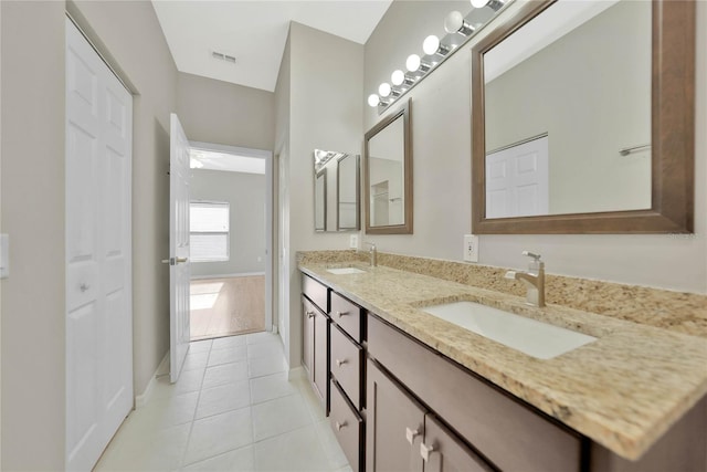 bathroom with vanity and tile patterned flooring