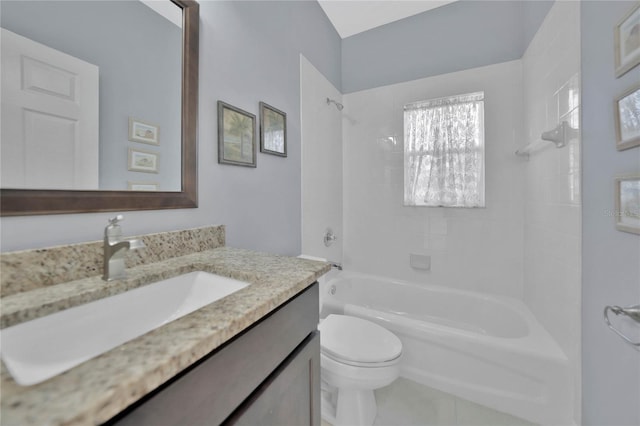 full bathroom with tile patterned floors, vanity, tiled shower / bath combo, and toilet