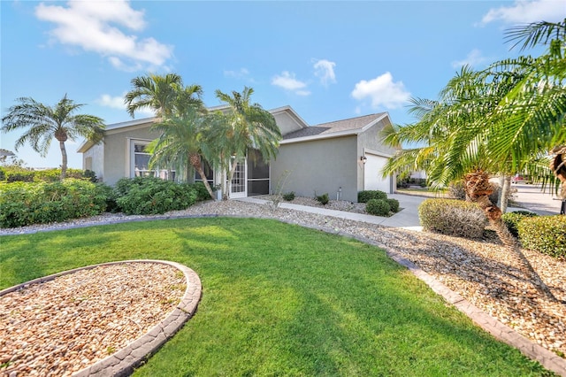 view of front of house with a garage and a front yard