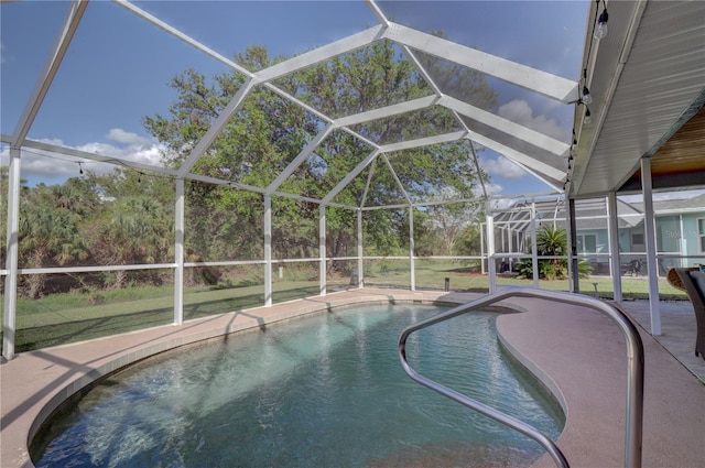 view of pool featuring a lanai and a yard