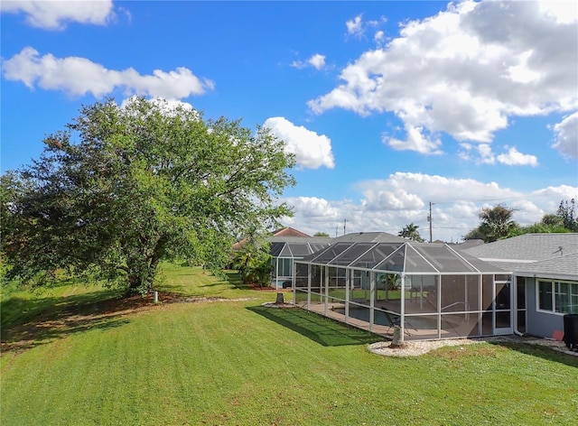 view of yard with a lanai